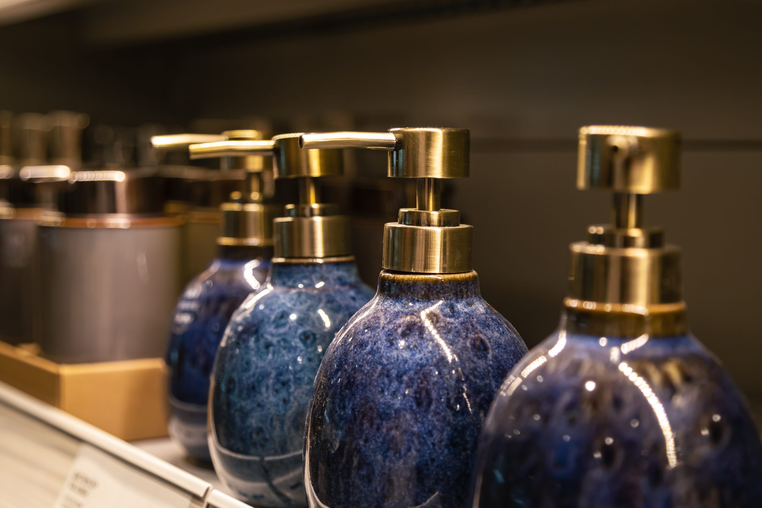 containers liquid soap shampoo with dispenser is sold supermarket scaled Парфюмерия Рени (Reni)